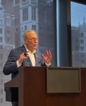 Senator Charles Schumer (D-NY) speaking at a podium